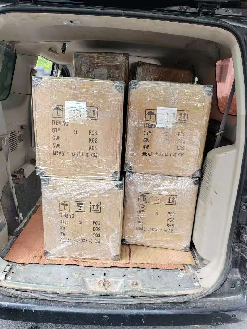 Loading packed cartons for China QC service delivery
