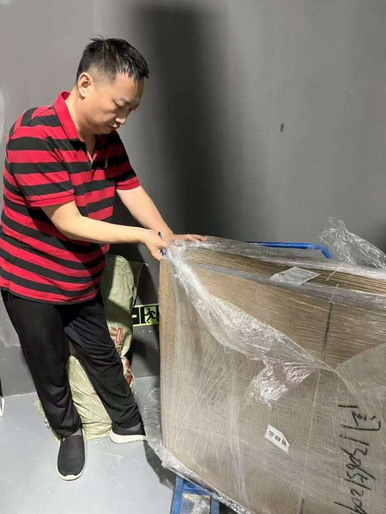 Expert wrapping goods during a strict China product inspection