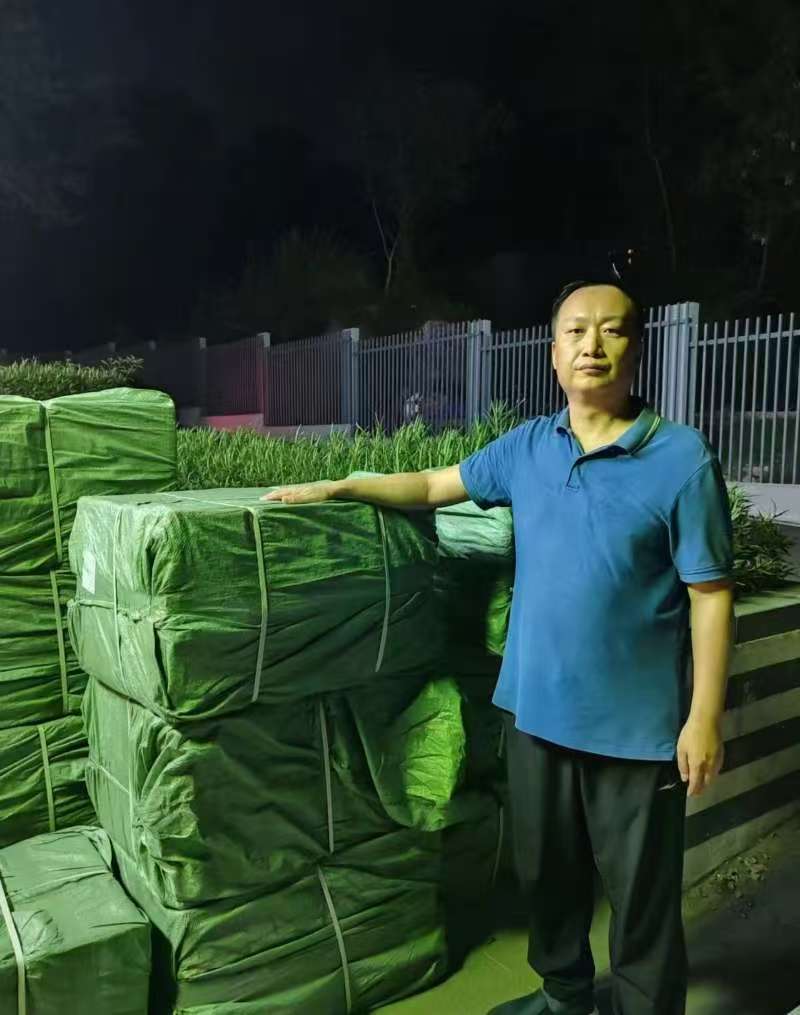 Dedicated China sourcing agent receiving goods at warehouse late at night