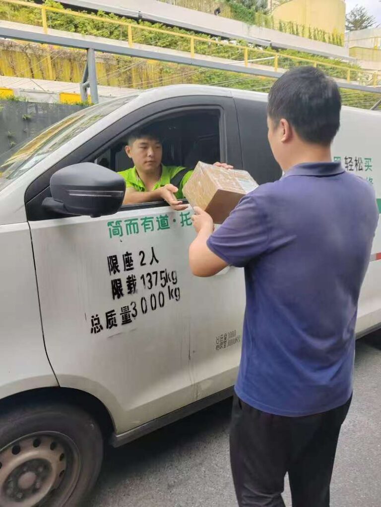 Agent handing a single sample to courier for order fulfillment China