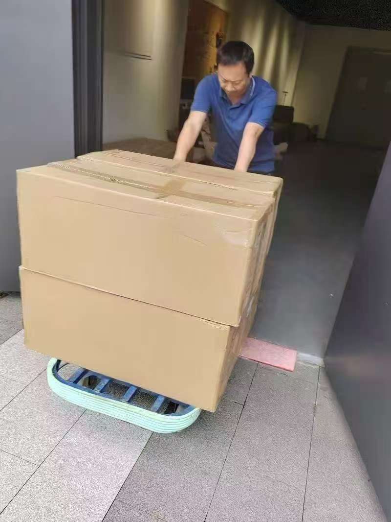 Moving consolidated goods on a trolley inside the warehouse.